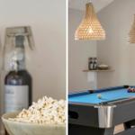 Pooltisch mit blauem Tuch und Körbchen. Hängende Lampen und Flaschen im Hintergrund.