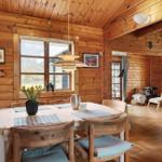 Wood-paneled kitchen with dining table and seating