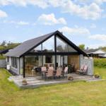 Modern villa with large glass area and terrace in the garden