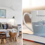 Living room with sofa, stools, and wall art. Mug with sailboat design.