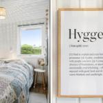 Bedroom with bed, window, and wall art Hygge.