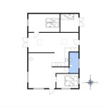 Apartment with two bedrooms, kitchen, and bathroom. Hallway and living area with window.