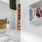 Schlafzimmer mit Holzbett und Bücherregal an der Wand.