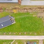 Aerial view of a vacation rental with large garden and terrace.