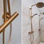 Duschkopf mit goldfarbenem Arm und Duschbrause an Marmorwand