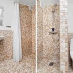 Badezimmer mit Dusche, Toilette und Waschbecken. Fliesen in Beigetönen.