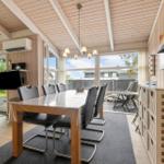 Dining area with table, chairs, and view of terrace