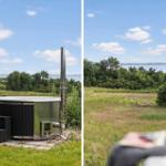 Outdoor area with hot tub and view of water and green fields