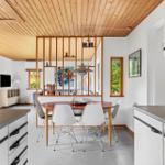 Kitchen with dining area and living room in background