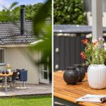 Deck with table, chairs, and flowers. Background: house with roof and grill.