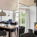 Dining area with table and chairs, wood-burning stove, and windows overlooking outside.