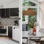 Kitchen with black cabinets and dining area with table and chairs.