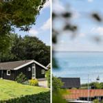 Black house with green lawn. View of the sea with boats.