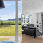 Living room with black leather sofa and wooden floor. Outside: grass field and water visible.