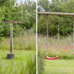 Hinterhof mit Spielgeräten und Wäscheleine. Gras und Bäume im Hintergrund.