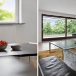 Living room with large window, sofa, and table with strawberries.