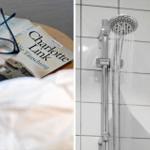 Bett mit Buch und Brille. Dusche mit Duschbrause und weißen Fliesen.
