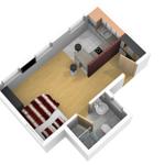 Ein Schlafzimmer mit Bett, Küche und Bad in einer Wohnung.