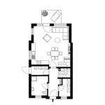 Dieses Apartment zeigt eine offene Küche, Essbereich und Wohnbereich mit Kamin.