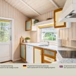 Küche mit Holzwänden, Arbeitsplatte und Fenster. Tür und Küchenspüle sind sichtbar.