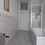 Bathroom with bathtub and shower
