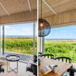 Wohnraum mit Blick auf Strand und Grünfläche. Esstisch mit Stühlen und Hängelampe.