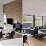 Modernes Wohn- und Esszimmer mit Steinwand, TV und großem Fensterblick.