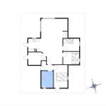 Floor plan of a studio apartment with kitchen, bathroom, and sleeping area.