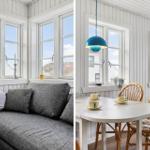 Living area with sofa and windows. Dining area with table, chairs, and lamp.