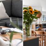 Wohnzimmer mit grauem Sofa und Holztisch. Essbereich mit Sonnenblumen und Holzstühlen.