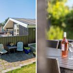 Haus mit Terrasse, Garten und Tisch mit Weinflasche und Gläsern.