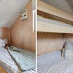 Zimmer mit Holzwand und Doppelbett. Ein Bett ist unter dem anderen angebracht.