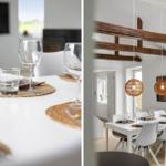 Esszimmer mit weißem Tisch, weißen Stühlen und Holzbalken an der Decke.