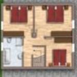Hausgrundriss mit zwei Schlafzimmern, Küche, Bad und Garage.