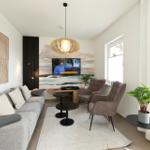 Wohnzimmer mit Sofa, zwei Sesseln, Fernseher und Pflanzen.