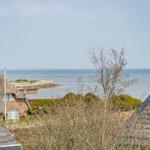 Sea view from roof terraces with traditional houses and trees
