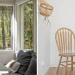 Ein Wohnzimmer mit Blick auf einen Wald und ein Holzstuhl in einem Raum mit weißer Wand.