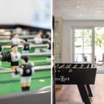 Fussballtisch mit Spielern im Innenraum. Hintergrund zeigt Terrasse mit Tisch und Stühlen.