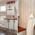 Badezimmer mit Dusche, Waschbecken und Holzwand. Handtuch und Bürste hängen an Haken.