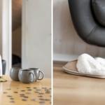 Tisch mit Thermoskanne, Tassen und Puzzleteilen. Weiche Hausschuhe neben einem Sessel.