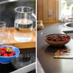 Küchenbereich mit Steinwaschbecken und Schale voller Erdbeeren.
