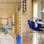 Küche und Essbereich mit Holzwänden, blauen Stühlen und moderner Einrichtung.