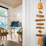 Raum mit Sitzgelegenheit, Fenster und Holzdekoration an der Wand.