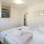 Bedroom with bed, wardrobe, and TV