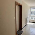 Bright Hallway with Window and Door