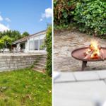 Haus mit Terrasse und Grillplatz im Garten. Feuer brennt im Feuerkorb.