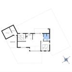 Funktionaler Grundriss mit Küche, Schlafzimmer, Bad und überdachter Terrasse.