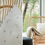 Rattan-Stuhl mit Kissen und Decke vor großem Fenster