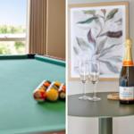 Billardtisch mit Bällen und Fensterblick. Champagnerflasche mit Gläsern auf Tisch.
