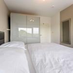 Bedroom with double bed, wardrobe, and mirror